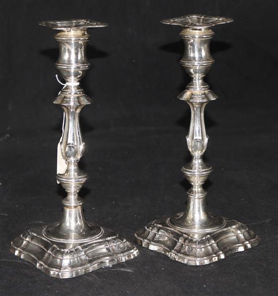 A pair of Edwardian silver candlesticks by William Thomas Imbrey, Sheffield, 1903, weighted.